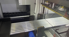 High precision CNC machine cutting aluminum extrusion profile in a factory