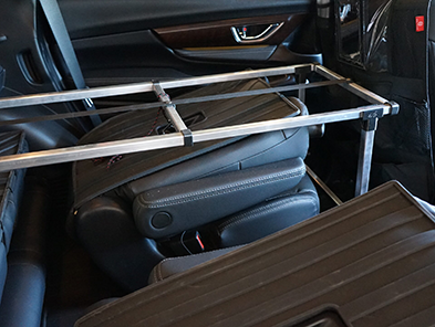 The retractable square tube frame inside the car