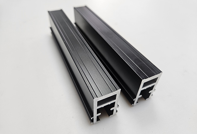Custom black anodized aluminum profile for retractable doors close-up